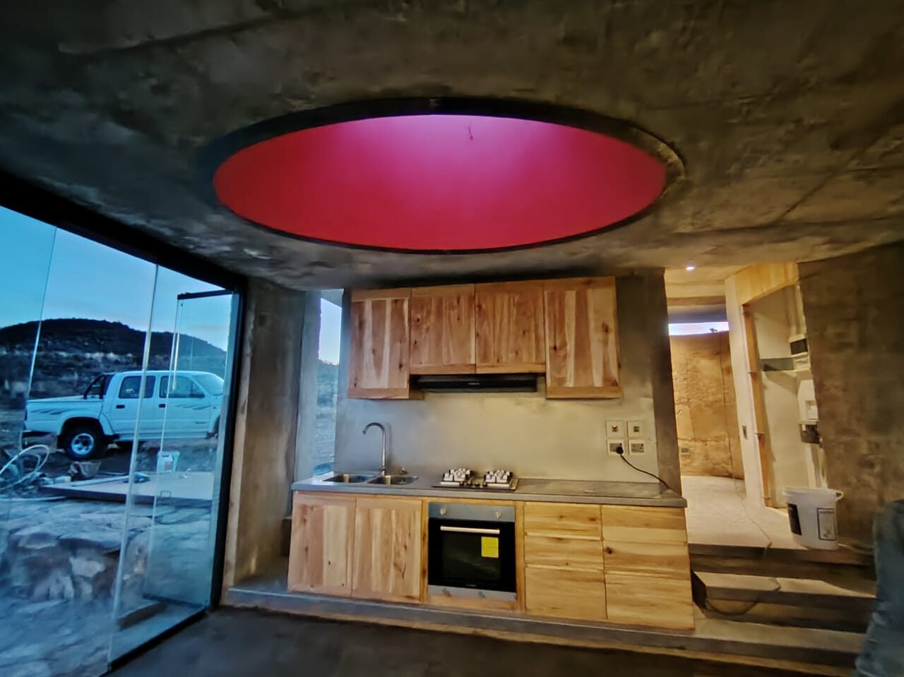 Interior — red circular skylight, kitchen